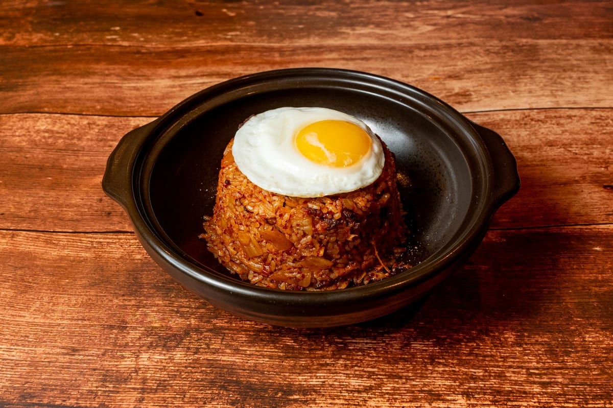 Kimchi fried rice topped with a fried egg, a takeout favorite