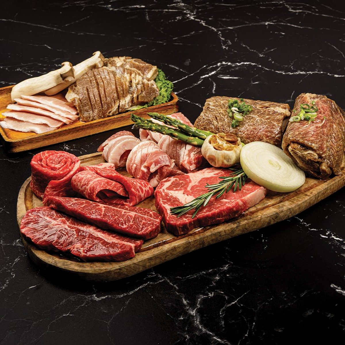 A party platter spread, beef and pork arranged for a large table